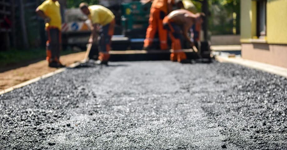 A group of men working on the road.